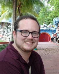 Headshot of Adrian Kane-Galbraith